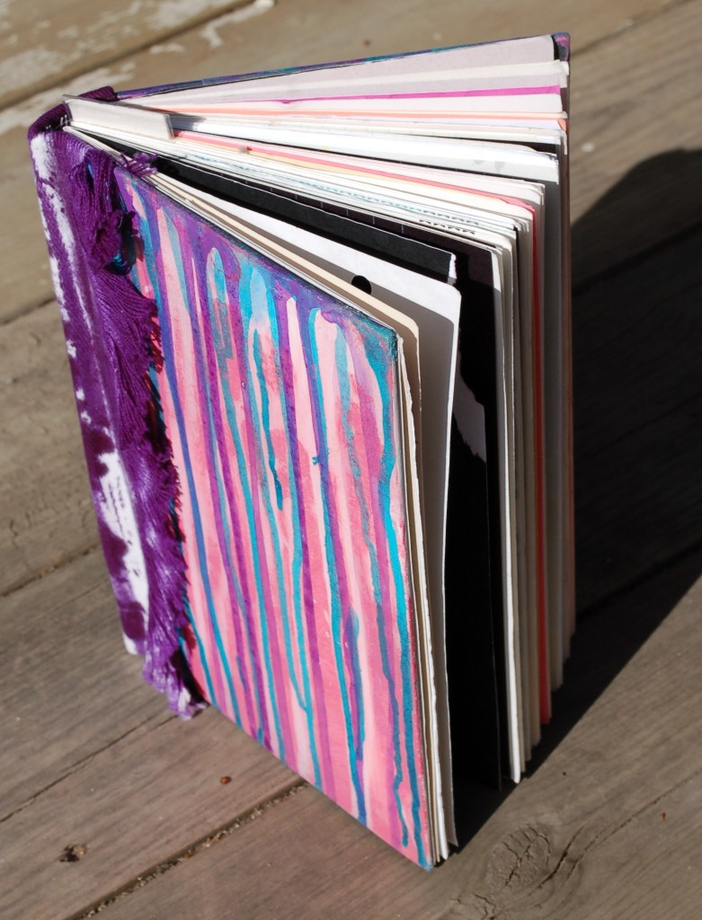 Cover view - paint drips and 1980's tie-dye denim spine.